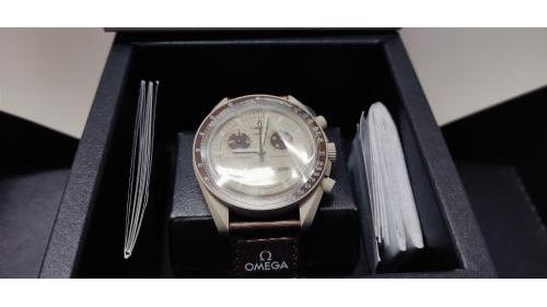 Omega Swatch Saturn, completo di corredo.